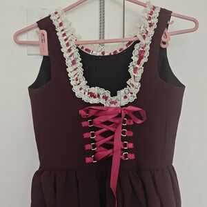 Lace-Trimmed Dress with Pink Ribbon